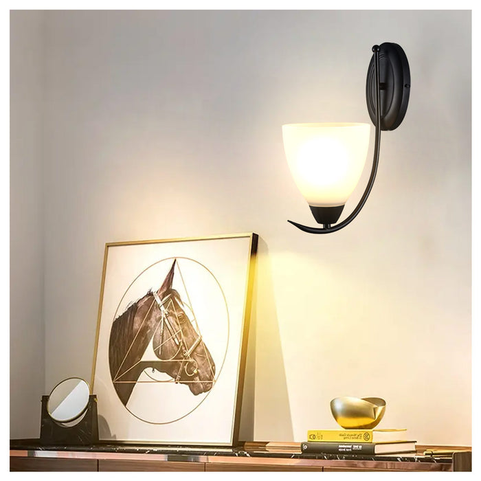 Curved Black Metal Frame With Elegant Wall Lamp